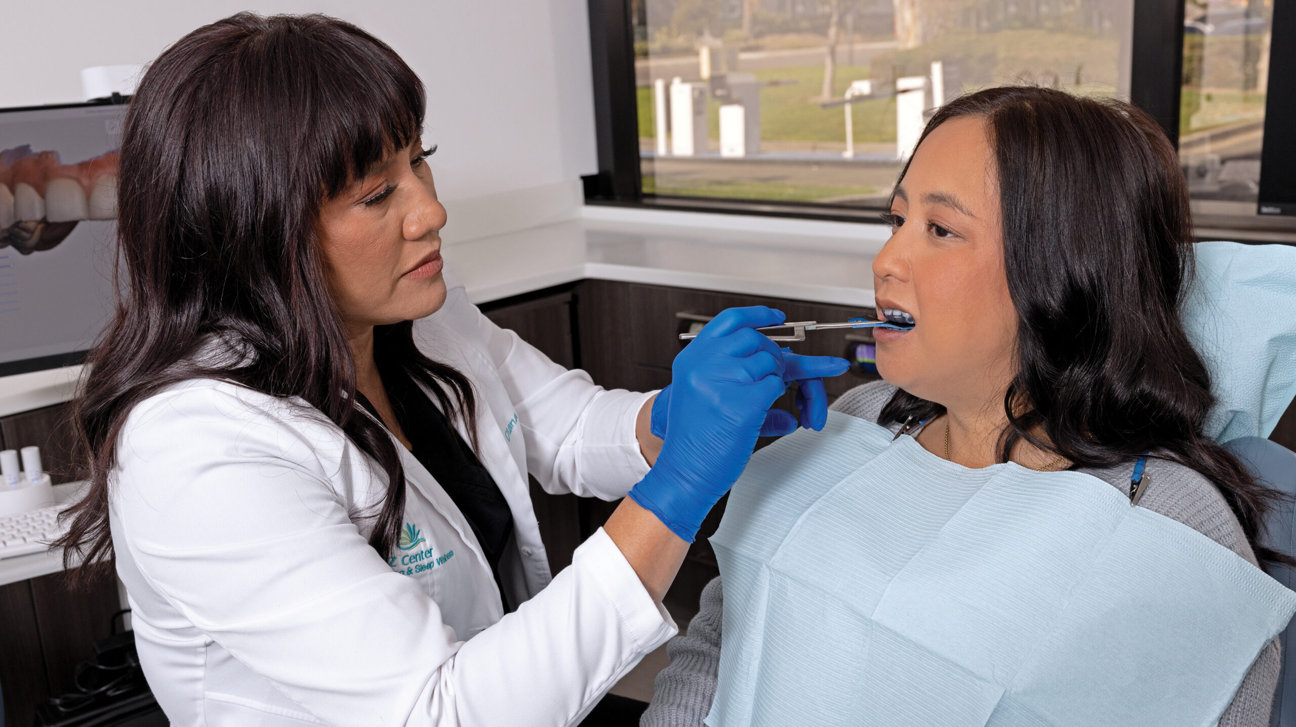Dr. Diana Batoon working with a patient during a procedure